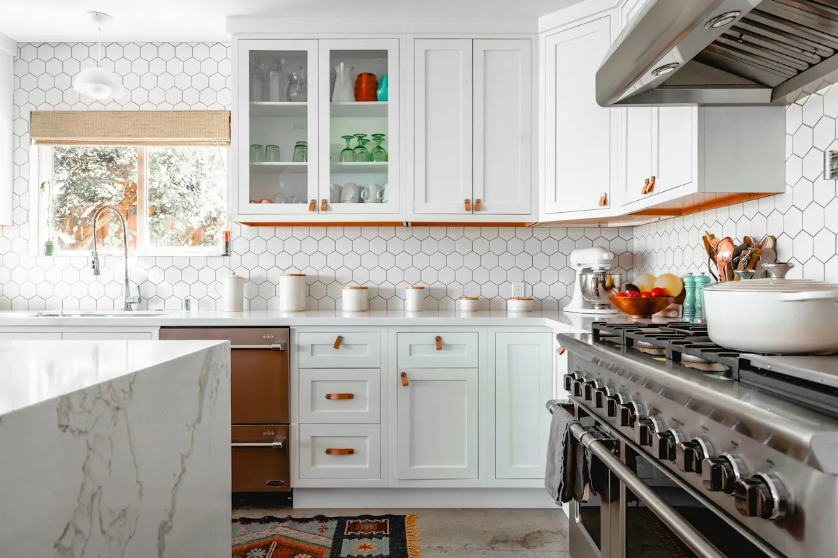 White painted inset kitchen cabinets with leather pulls in a Mobile AL kitchen