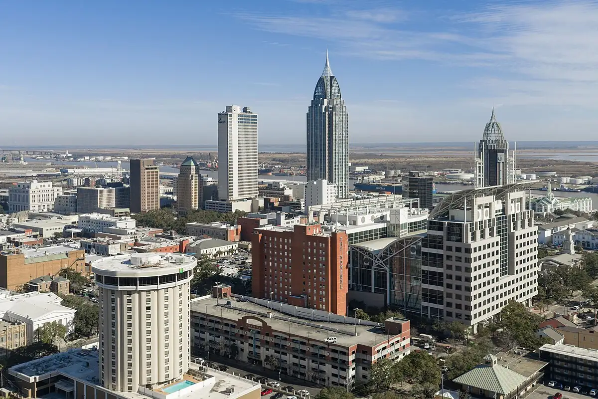 Downtown Mobile AL seen from above with the port and Mobile Bay behind
